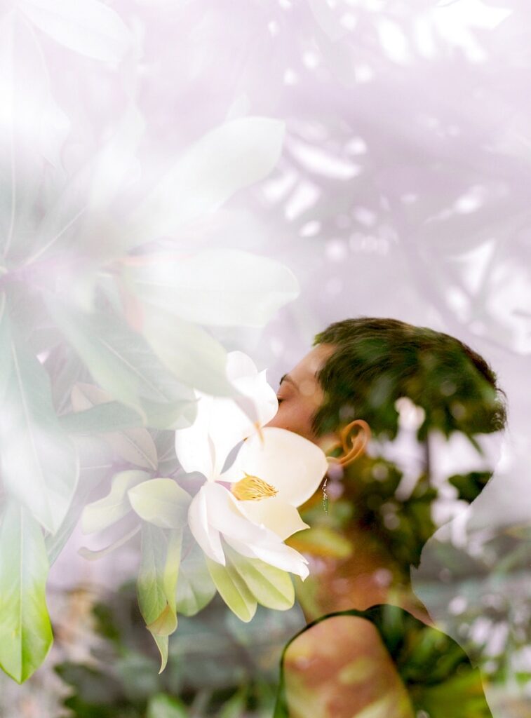 mindfulness, woman in white shirt standing near white flowers