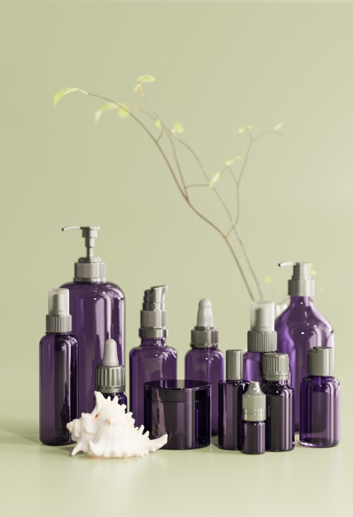 a group of purple bottles sitting on top of a table