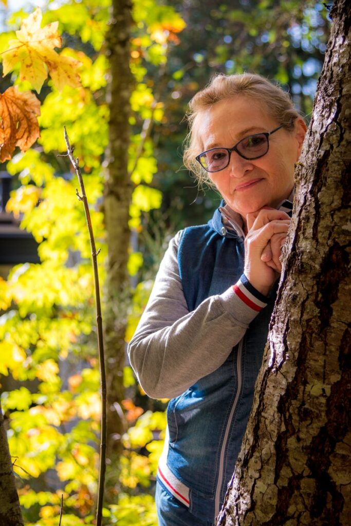 Woman Standing Behind Tree