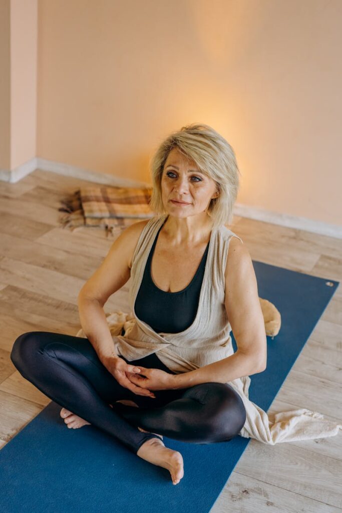 High-Angle Shot of an Elderly Woman Meditating